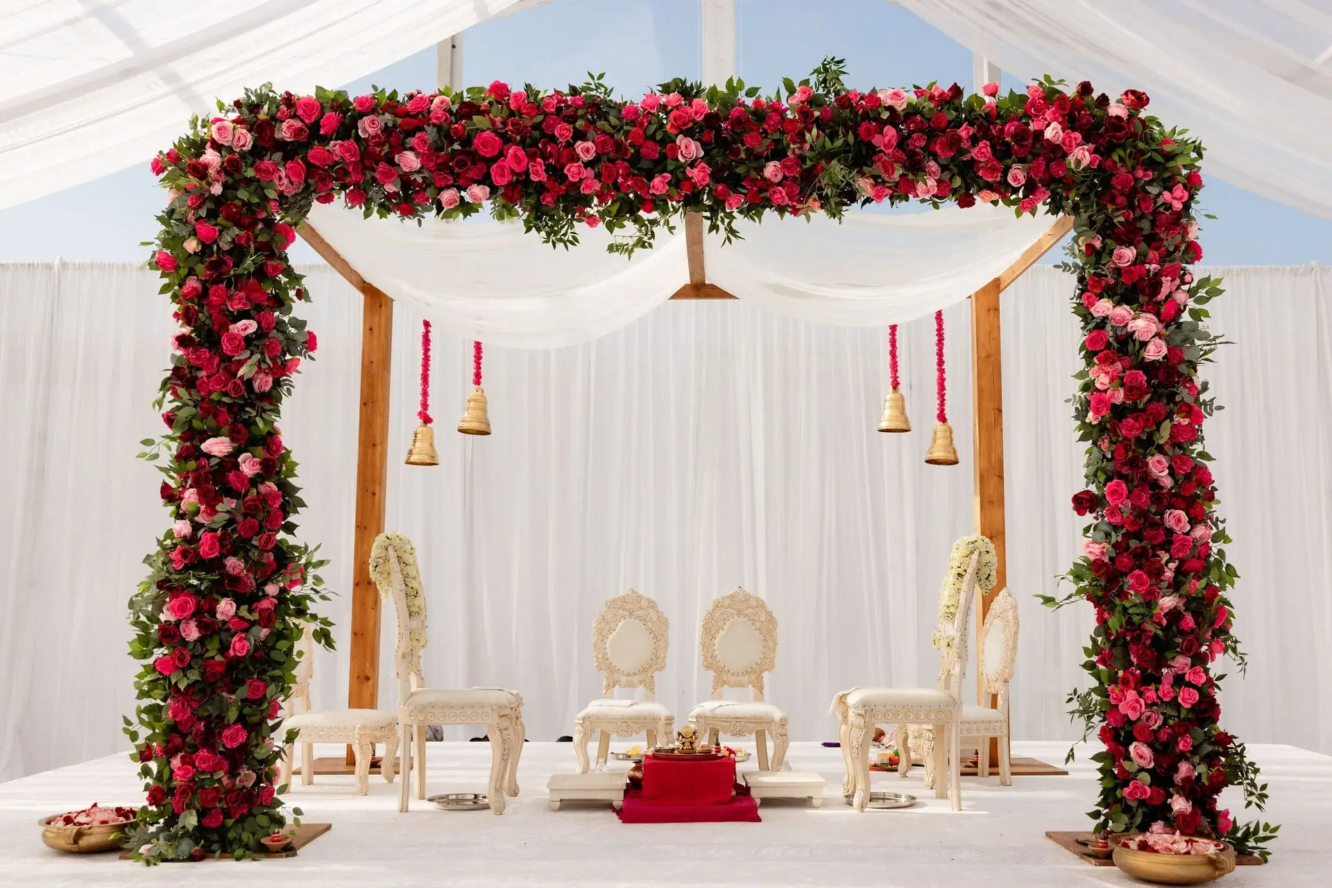Detail of place setting layered with menu and florals