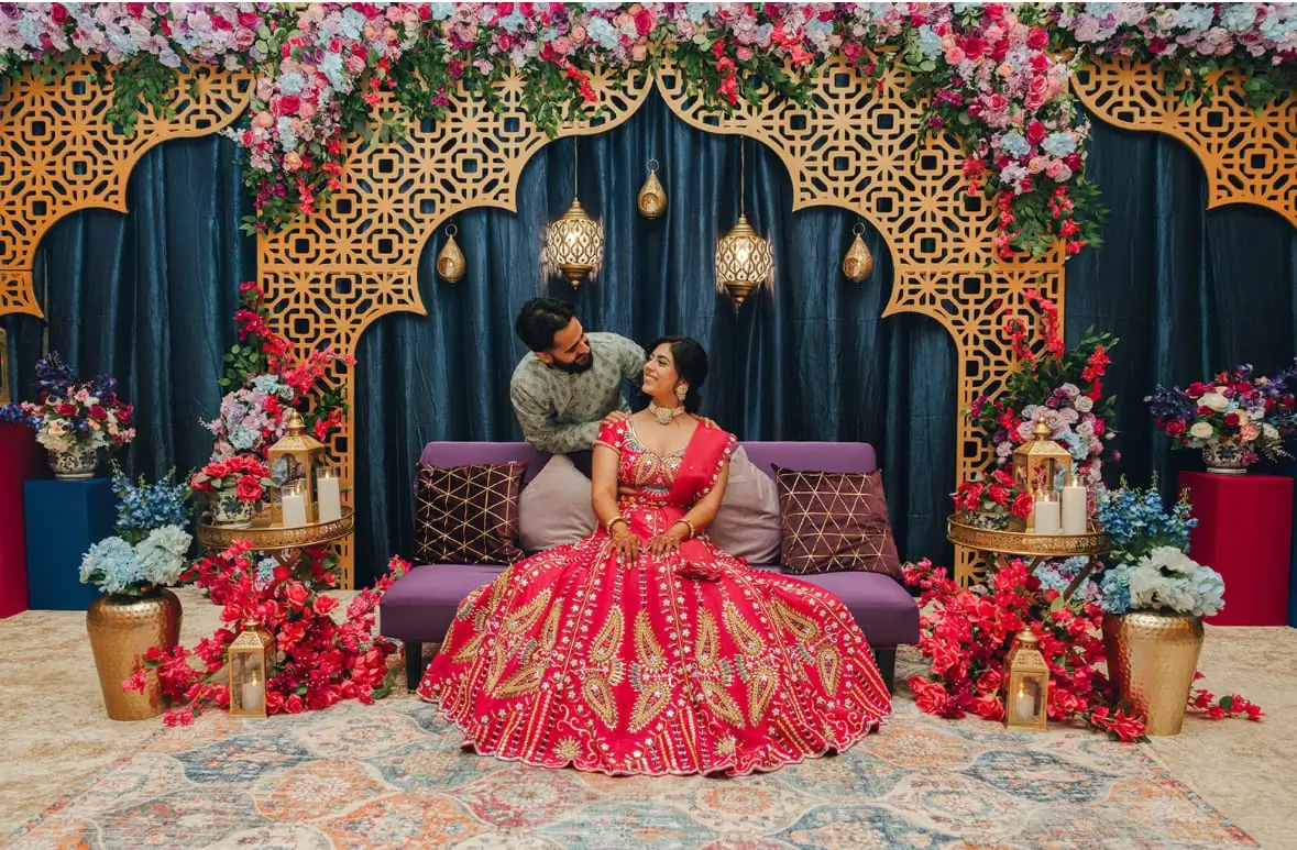 Ritual flame and rose petals on a brass thali
